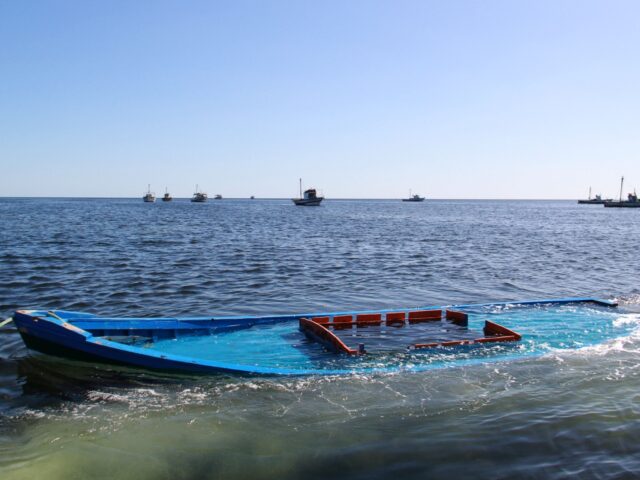 A picture taken on October 13, 2020, shows a boat, which was carrying 29 people and sank o