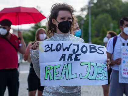 A demonstrator displays a placard reading: "Blow Jobs are Real Jobs" during a pr