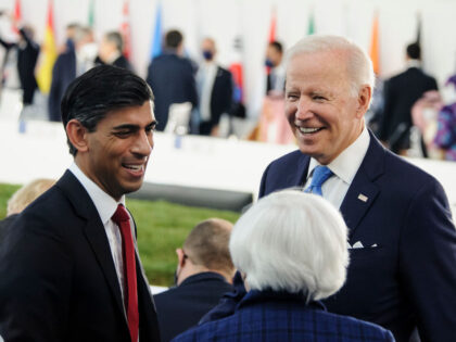 ROME, LAZIO, ITALY - 2021/10/30: Joe Biden (R), President of the United States, seen joking and talking with UK Chancellor of the Exchequer, Rishi Sunak, during the first day of the summit. The G20 Summit of Head of States in La Nuvola centre, lead by the Italian Prime Minister, Mario …