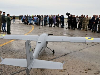 Journalists attend the presentation of a UJ-22 Airborne (UkrJet) reconnaissance drone, bought in the frame of the program 'The Army of Drones' and set up ready for test flights in the Kyiv region on August 2, 2022, prior to being sent to the front line. - 'The Army of Drones' …