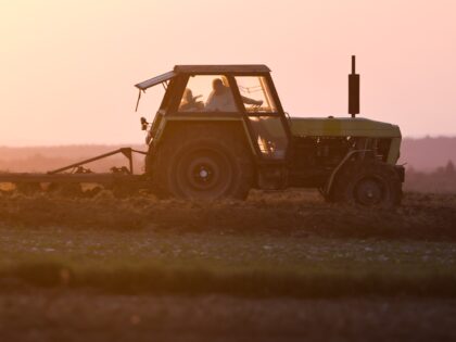 A farm tractor works on a field in Poland on September 5, 2022. (Photo by Jakub Porzycki/NurPhoto via Getty Images)