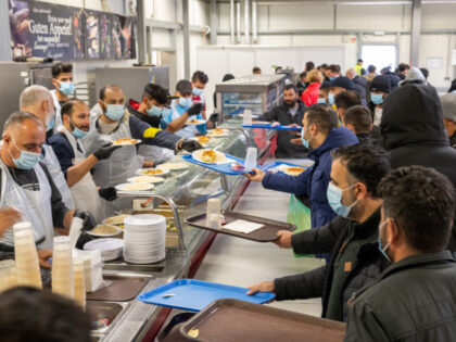 PRODUCTION - 16 November 2022, Baden-Wuerttemberg, Ellwangen: Refugees are crowding the food counter at the state's initial reception center (LEA). If the city has its way, the LEA will be closed by the end of 2022. Photo: Stefan Puchner/dpa (Photo by Stefan Puchner/picture alliance via Getty Images)