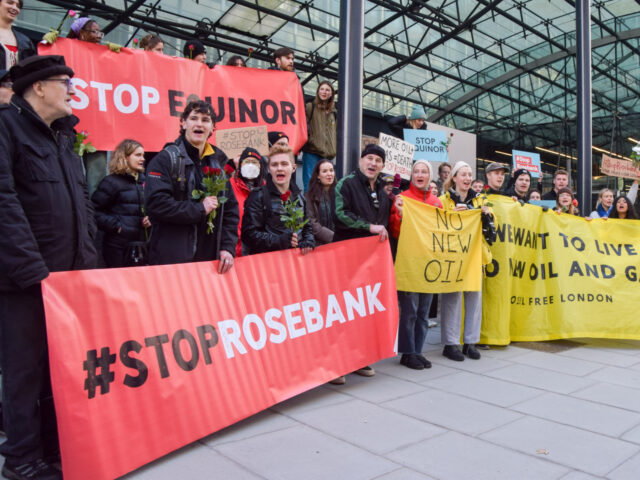 LONDON, UNITED KINGDOM - 2023/01/15: Protesters hold anti-fossil fuel banners during the d