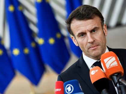 France's President Emmanuel Macron answers journalists' questions as he arrives for a summit at EU parliament in Brussels, on February 9, 2023. - Ukraine's President is set to attend an EU summit in Brussels on February 9, 2023, as the guest of honour where he will press allies to deliver …
