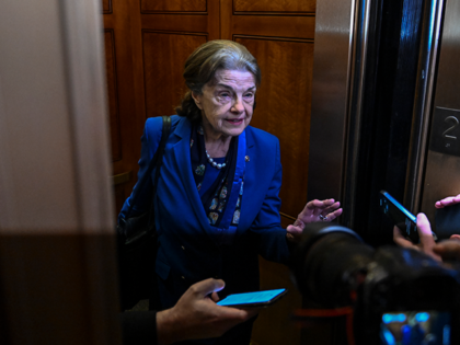 Sen. Dianne Feinstein (D-CA) is mobbed by reporters as she enters an elevator at the U.S. Capitol on February 14, 2023 in Washington, D.C. Feinstein announced that she will not seek reelection. (Photo by Ricky Carioti/The Washington Post via Getty Images)