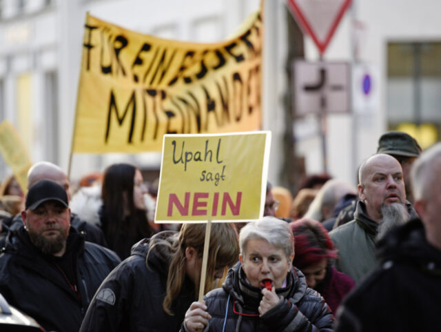 24 March 2023, Mecklenburg-Western Pomerania, Grevesmühlen: People protest at a demonstra