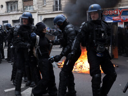 PARIS, FRANCE - MARCH 28: French riot Police intervene protesters during a demonstration after the French government pushed a pensions reform through parliament without a vote, using the article 49.3 of the constitution, in Paris, France on March 28, 2023. (Photo by Ibrahim Ezzat/Anadolu Agency via Getty Images)