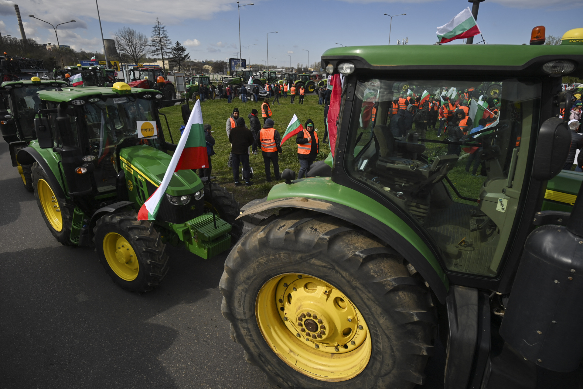 Farmers drive their tractors during an action to block trucks crossing the Danube bridge, marking the border between Bulgaria and Romania in a protest against the duty-free import of grain coming from Ukraine into the EU, in Rousse on March 29, 2023. (Photo by Nikolay DOYCHINOV / AFP) (Photo by NIKOLAY DOYCHINOV/AFP via Getty Images)