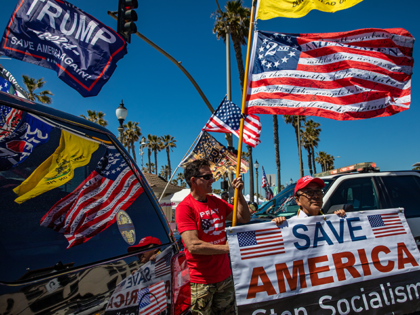 Pro-Trump rally takes near pier along Pacific Coast Highway Saturday, April 1, 2023 in Hun