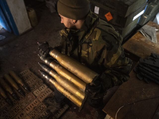 BAKHMUT, UKRAINE - APRIL 02: A Ukrainian soldier holds artillery ammunition near the front