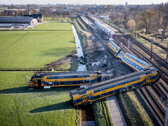 This aerial view shows a derailed night train in Voorschoten on April 4, 2023. - At least