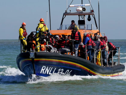 A group of people thought to be migrants are brought in to Dungeness, Kent, onboard the RN