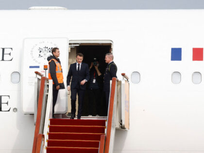 French President Emmanuel Macron arrives at Beijing Capital International Airport in Beiji