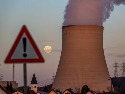 05 April 2023, Bavaria, Essenbach: Water vapor rises from the cooling chamber of the Isar 2 nuclear power plant behind a warning sign. According to the Atomic Energy Act, the final shutdown of the power plant is to take place on April 15. Photo: Armin Weigel/dpa (Photo by Armin Weigel/picture …