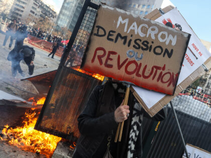 PARIS, FRANCE - APRIL06: Protesters hold union flags and placards during a demonstration after the French government pushed a pensions reform through parliament without a vote, using the article 49.3 of the constitution, in Paris, France on April 6, 2023. (Photo by Ibrahim Ezzat/Anadolu Agency via Getty Images)