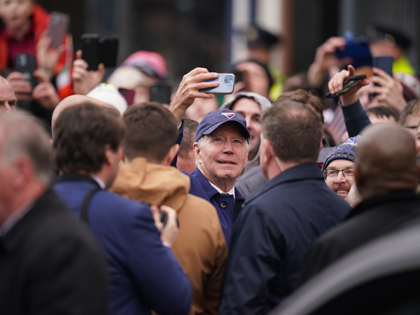 US President Joe Biden takes a selfie while on a walkabout through Dundalk, Co Louth, duri
