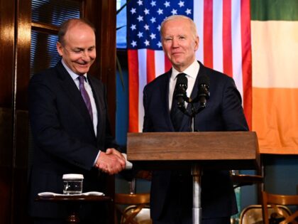US President Joe Biden (R) shakes hands with Ireland's Minister of Foreign Affairs Micheal Martin before delivering a speech at the Windsor Bar in Dundalk, on April 12, 2023, as part of a four days trip to Northern Ireland and Ireland for the 25th anniversary commemorations of the "Good Friday …