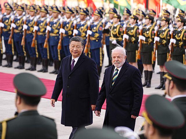 Chinese President Xi Jinping (L) and Brazil's President Luiz Inacio Lula da Silva attend a welcome ceremony at the Great Hall of the People in Beijing on April 14, 2023. (Photo by Ken Ishii / POOL / AFP) (Photo by KEN ISHII/POOL/AFP via Getty Images)