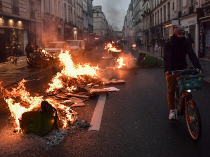 PARIS, FRANCE - APRIL 14: Demonstrators set a fire during a protest against the government after pushing the pensions reform without a vote using article 49.3 of the constitution, and surviving a no-confidence motion at the parliament, in Paris, France on April 14, 2023. (Photo by Firas Abdullah/Anadolu Agency via …