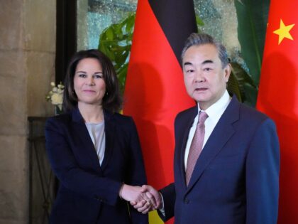 15 April 2023, China, Peking: Foreign Minister Annalena Baerbock (Bündnis 90/Die Grünen) and Wang Yi, Politburo member and Director of the Office of the Foreign Affairs Commission of the Central Committee of China, meet for a working breakfast in the Great Hall of the Hotel St. Regis Bejing. Photo: Soeren …