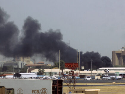 Heavy smoke billows above buildings in the vicinity of the Khartoum airport on April 15, 2