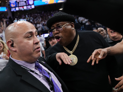 Earl Tywone Stevens Sr., known as the rapper E-40, yells at arena security personnel before being escorted from courtside seating during Game One of the Western Conference First Round Playoffs between the Golden State Warriors and Sacramento Kings at the Golden 1 Center on April 15, 2023 in Sacramento, California. …