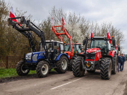 Tractors are seen during farmers protest near the rail line on the border with Ukraine in Hrubieszow, Poland on April 16, 2023. Polish farmers protest against Ukrainian agricultural products imports, which instead of being transported through Poland to the countries of destination, stays in the country and floods the market. …