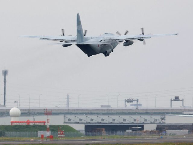 A Japan Air Self-Defense Force C-130 transport plane takes off for Djibouti in preparation