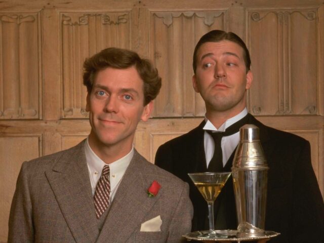 Comic actors Hugh Laurie (L) and Stephen Fry in character as Bertie Wooster and Reginald Jeeves in the period comedy Jeeves And Wooster, circa 1990. (Photo by TV Times via Getty Images)