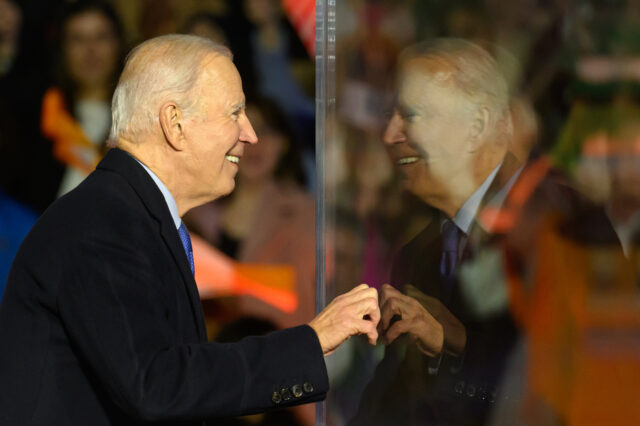 BALLINA, IRELAND - APRIL 14: US President Joe Biden peers around a protective bullet=proof