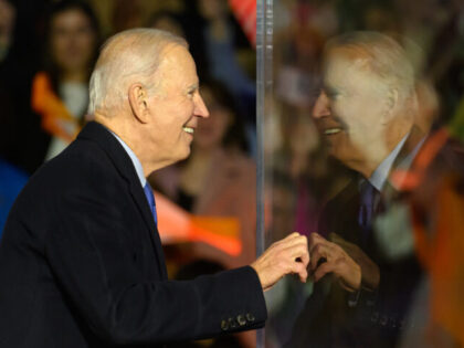 BALLINA, IRELAND - APRIL 14: US President Joe Biden peers around a protective bullet=proof