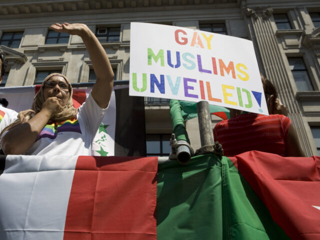 Members of the British gay, lesbian, bisexual, and transgender Muslim group Imaan wave fro