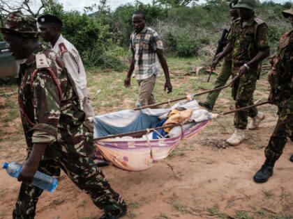 TOPSHOT - Security personnel carry a rescued young person from the forest in Shakahola, outside the coastal town of Malindi, on April 23, 2023. - Twenty-one bodies have been exhumed in Kenya while investigating a cult whose followers are believed to have starved themselves to death, police sources said on …