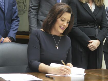 Michigan Gov. Gretchen Whitmer signs an executive order creating a bipartisan task force to review Michigan's jail and pretrial incarceration system Wednesday, April 17, 2019, outside the state Supreme Court chambers at the Hall of Justice in Lansing, Mich. Whitmer is ordering a comprehensive review of Michigan's jail and pretrial …
