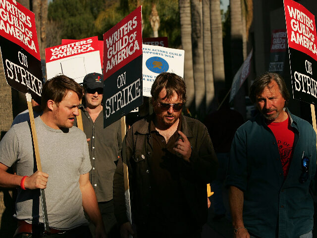 Writers Guild of America members and supporters picket in front of NBC studios as hope gro