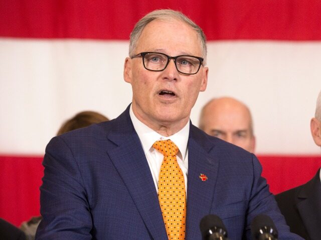 OINT BASE LEWIS-MCCHORD, WA - MARCH 05: Washington State Governor Jay Inslee (C) addresses the press during a visit by Vice President Mike Pence to discuss concerns over the coronavirus, COVID-19, on March 5, 2020 at Camp Murray adjacent to Joint Base Lewis-McChord, Washington. They are joined by members of …