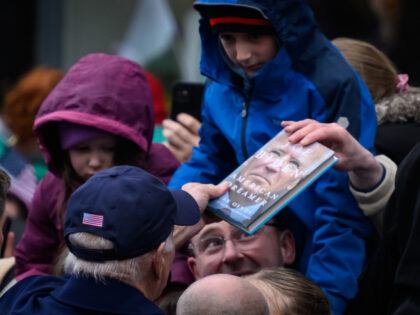 DUNDALK, IRELAND - APRIL 12: US President Joe Biden returns a copy of his autobiography to