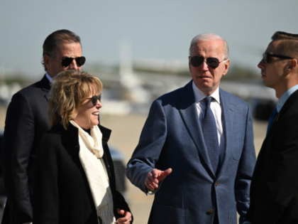 US President Joe Biden, with his sister Valerie Biden (2nd L), and son Hunter Biden (L), a
