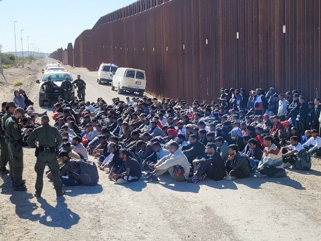 Ajo Station Border Patrol agents apprehend a large migrant group in the Arizona desert. (U