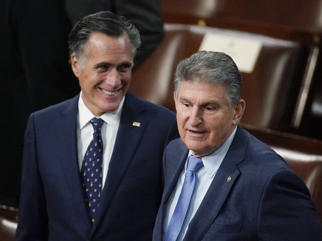 Sen. Joe Manchin, D-W.Va., right, and Sen. Mitt Romney, R- Utah, arrives to hear President