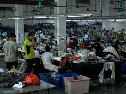 Workers make clothes at a garment factory that supplies SHEIN, a cross-border fast fashion e-commerce company in Guangzhou, in Chinas southern Guangdong province on July 18, 2022.