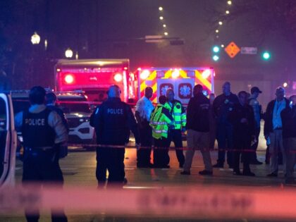 Chicago police and emergency medical responders gather at the scene of a mass shooting on Chicago&apos;s West Side near Polk Street and California Avenue on Oct. 31, 2022.