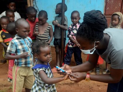 A child's finger is marked after receiving a polio vaccine during a nationwide polio vaccination exercise in Nyimbwa subcounty of Luwero district, Uganda, Nov. 4, 2022. Uganda on Friday started a nationwide door to door polio vaccination exercise targeting 8.7 million children aged below five years.