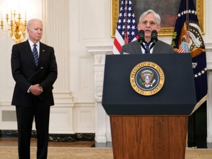 President Joe Biden, left, listens as Attorney General Merrick Garland, right, speaks during an event in the State Dining room of the White House in Washington, Wednesday, June 23, 2021, to discuss gun crime prevention strategy.