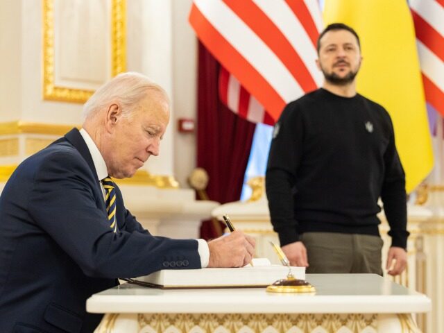 KYIV, UKRAINE - FEBRUARY 20: In this handout photo issued by the Ukrainian Presidential Press Office, U.S. President Joe Biden signs the guest book during a meeting with Ukrainian President Volodymyr Zelensky at the Ukrainian presidential palace on February 20, 2023 in Kyiv, Ukraine. The US President made his first …