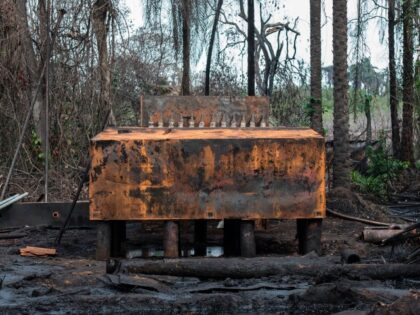 A view of an illegal oil refinery destroyed by members of the NNS Pathfinder of the Nigerian Navy forces is pictured on April 19, 2017 in the Niger Delta region near the city of Port Harcourt. NNS Pathfinder of the Nigerian Navy forces are cracking down on illegal oil refineries …