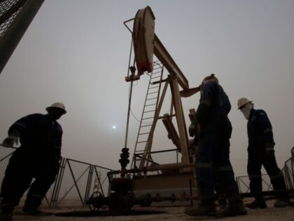 FILE - In this Jan. 8, 2015 file photo, men work on an oil pump during a sandstorm in the desert oil fields of Sakhir, Bahrain. The price of oil dipped below $45 a barrel Tuesday, Jan. 13, 2015, following the latest sign from OPEC that the group doesn’t plan …