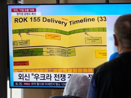 A TV screen shows a news program reporting on the leaked Pentagon documents at the Seoul Railway Station in Seoul, South Korea, Wednesday, April 12, 2023.