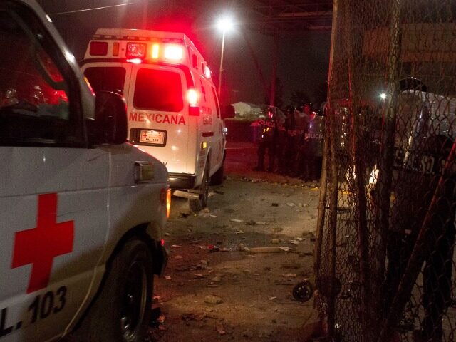 Mexican Red Cross ambulances enter the Apodaca State prison near Monterrey, Mexico Tuesday