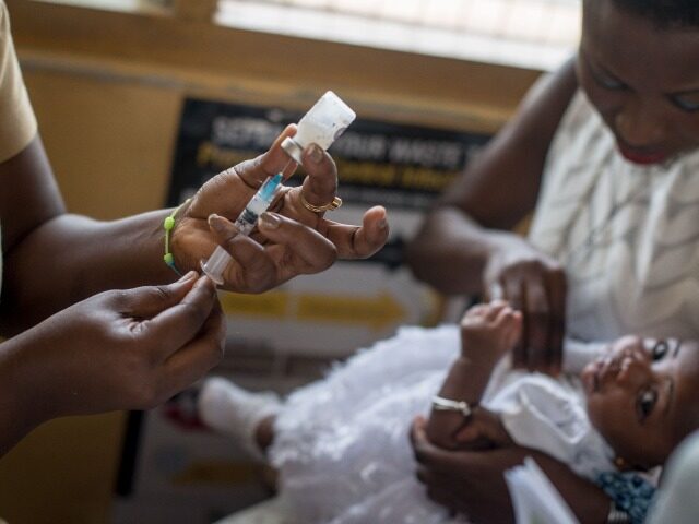 A baby receives vaccine by a nurse at the maternity ward of the Ewin Polyclinic in Cape Co